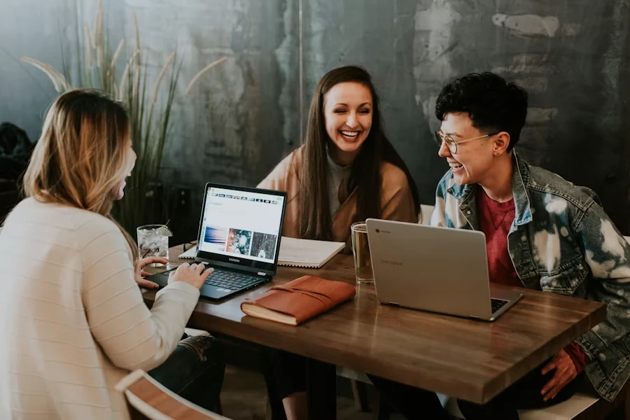 People collaborating around a laptop
