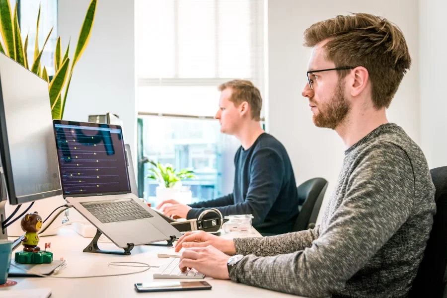 Business team reviewing work together at a laptop